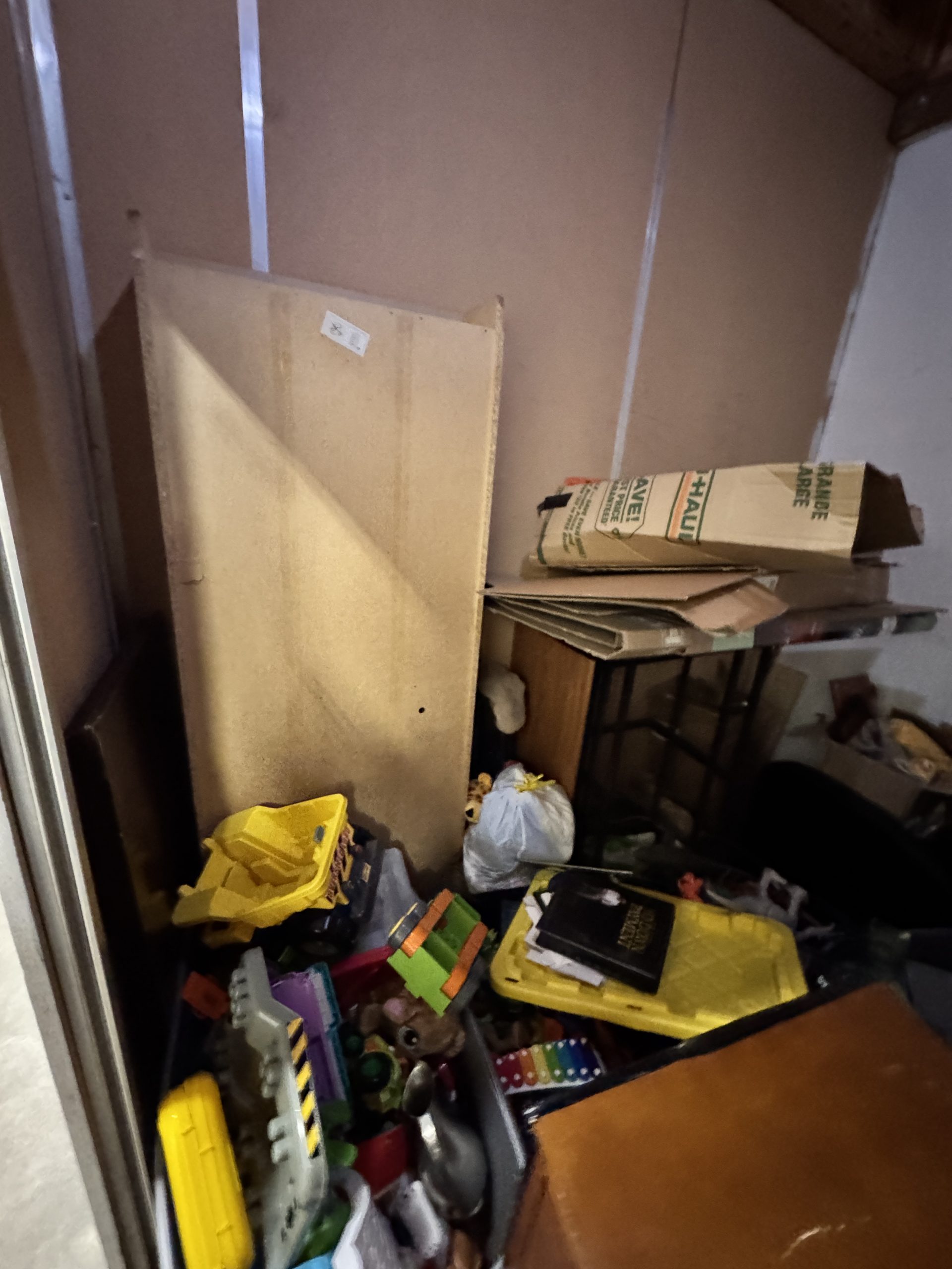 Full storage unit with mixed items ready for professional cleanout service