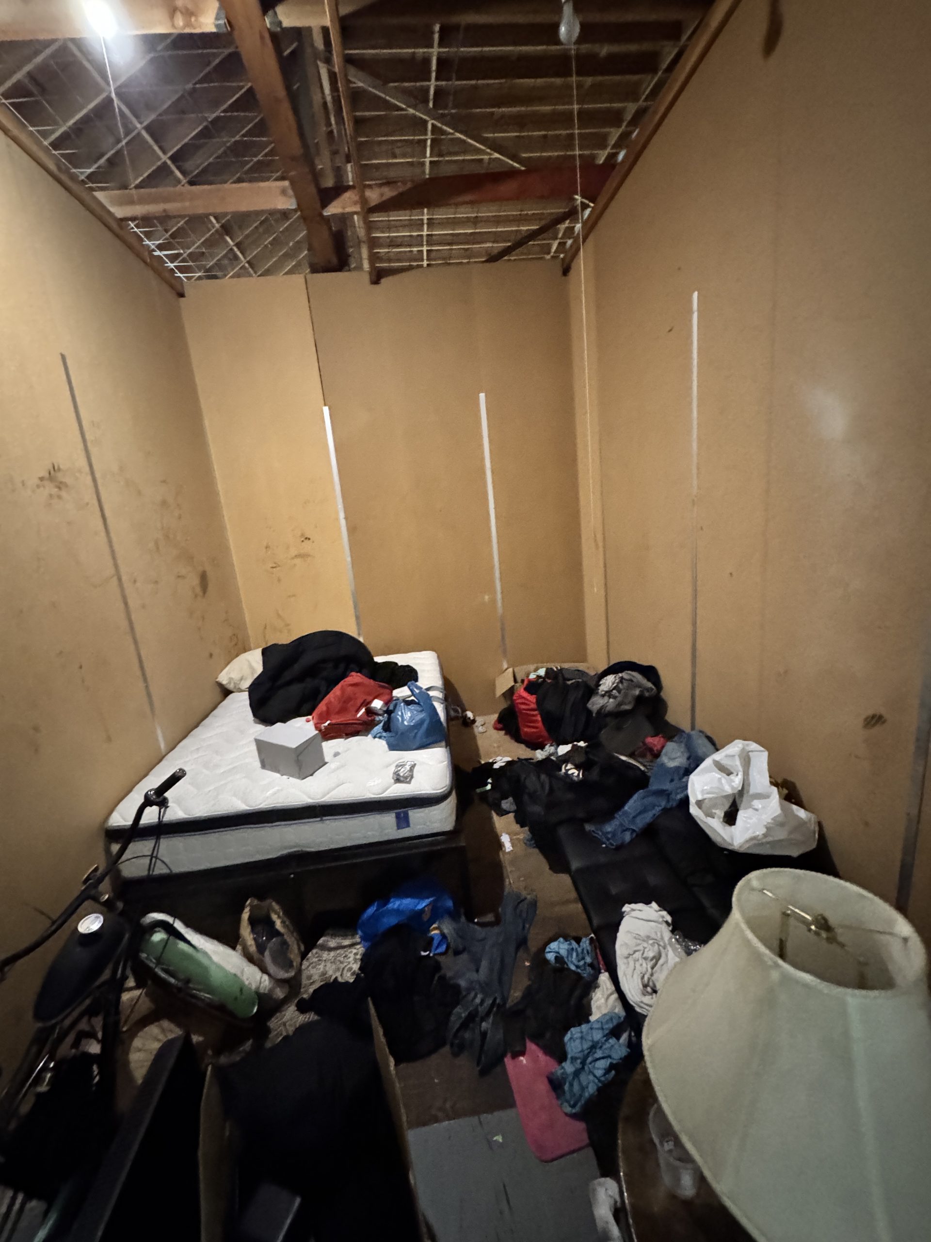 Cluttered storage unit with mixed items for cleanout service