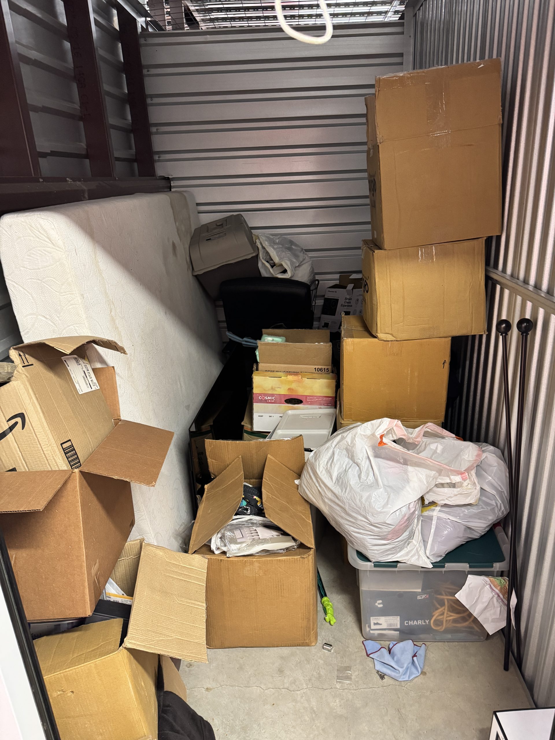 Storage unit full of household items needing professional removal